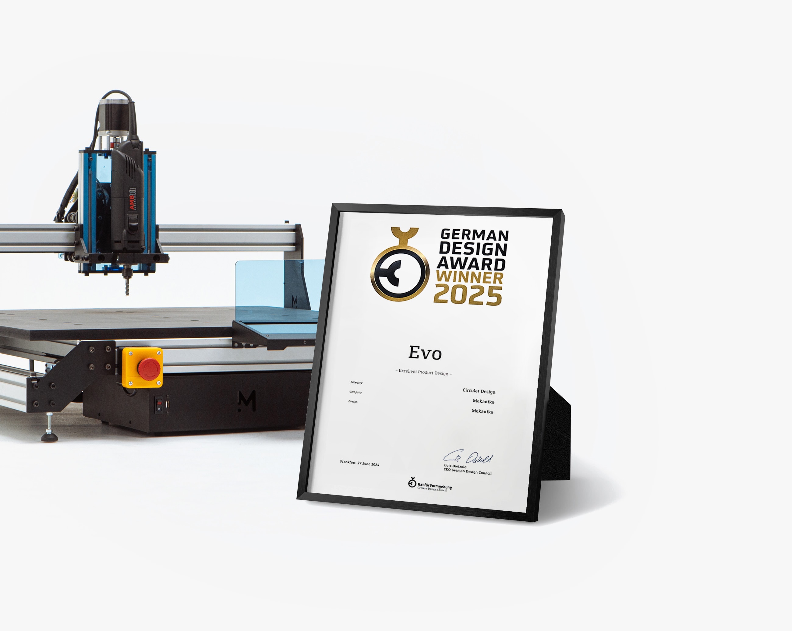 German Design Award certificate framed in front of a Mekanika Evo CNC milling machine