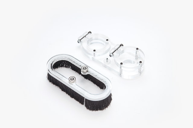 A Mekanika dust shoe 59mm disassembled in two plexiglass parts