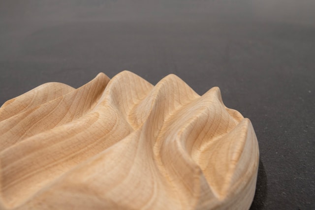 A wave sculpted in 3D from beech wood