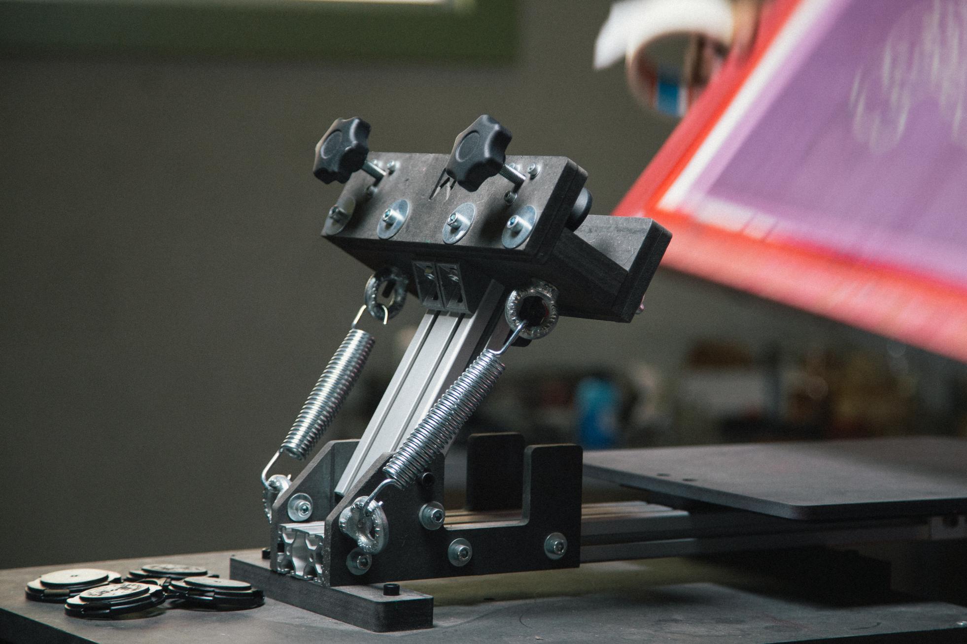 Close up on lifting arm of Mekanika screen printing press