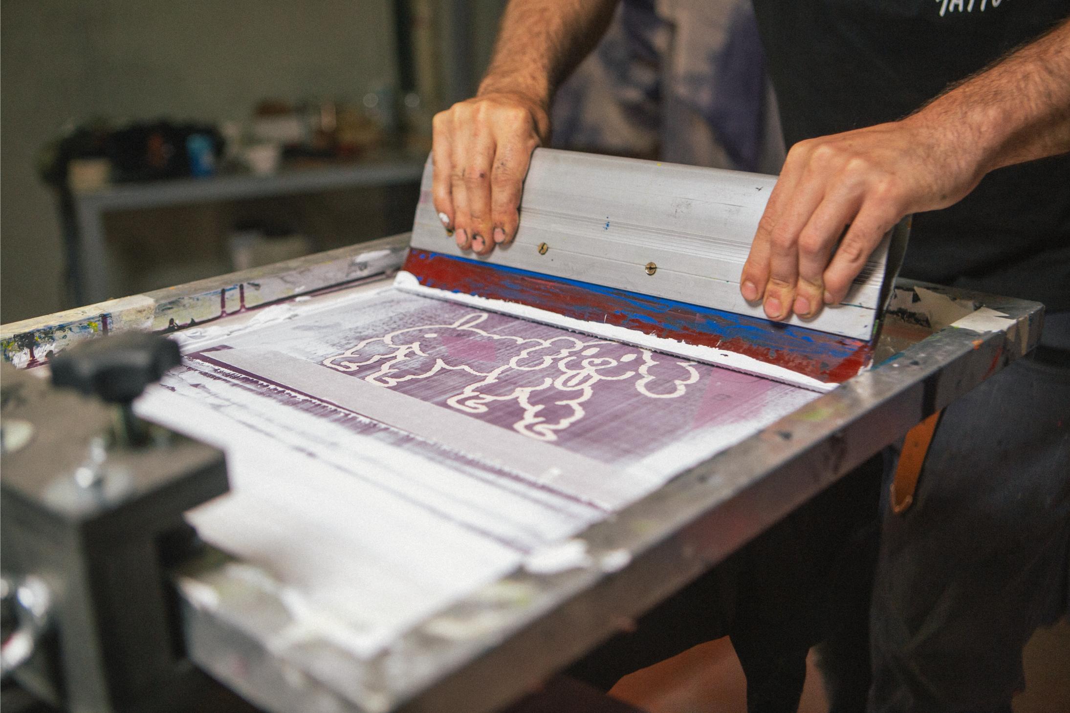 Close up on the printing process using Mekanika screen printing press